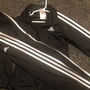Adidas track suit.